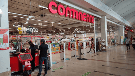 a group of people standing in front of a store
