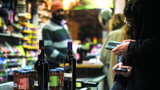 a person holding a bottle of wine