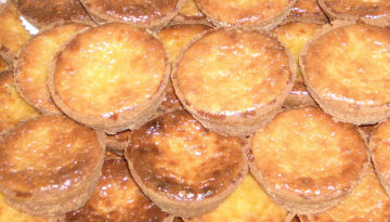 A close-up view of several caramelized pastries stacked in layers.