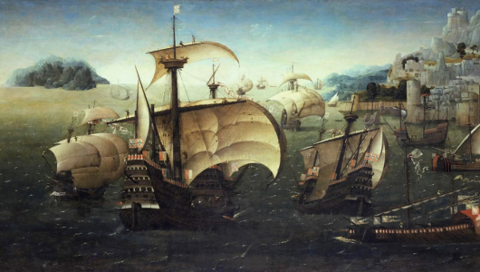 Portuguese Historic ships with sails on a choppy sea near a coastal town.